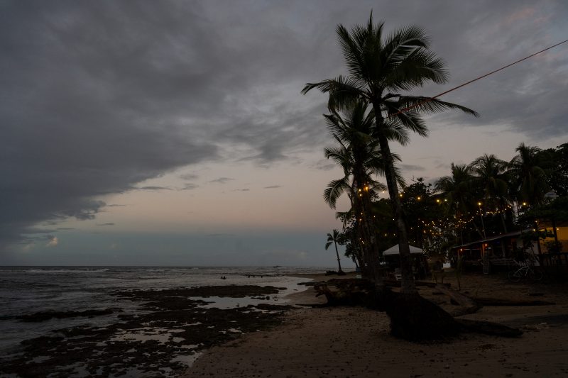Tropical beach scene with ocean and lush green trees. Puerto Viejo de Talamanca, Costa Rica, 2024, © Dirk Heurich, dirksn.com