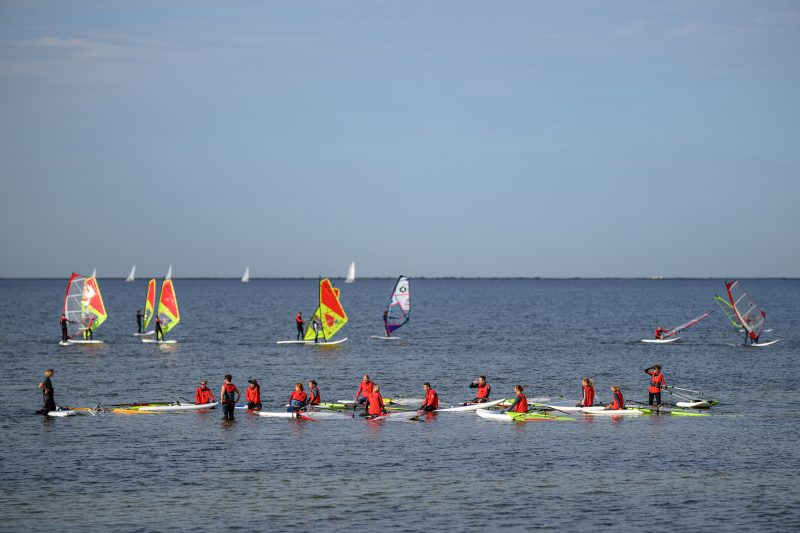 Kayaking pink plush toy on calm lake Copyright Dirk Heurich dirksn.com