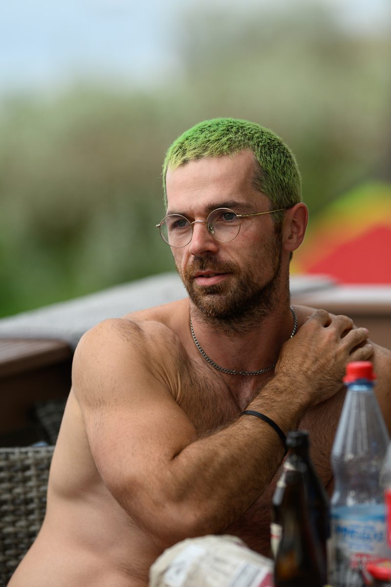 Kayaking pink plush toy on calm lake Copyright Dirk Heurich dirksn.com