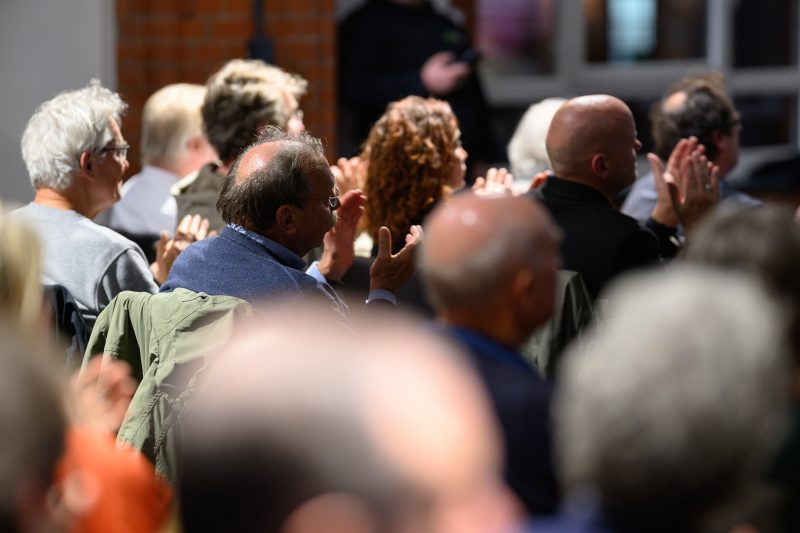 Man speaking into microphone at an event © Dirk Heurich dirksn.com