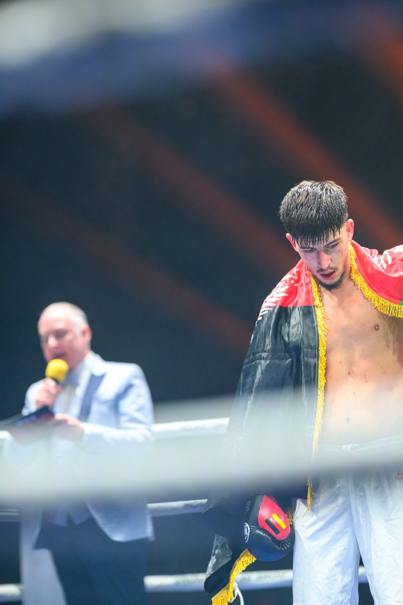 Boxers mid-fight in intense boxing match © Dirk Heurich dirksn.com