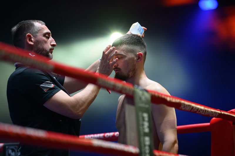 Boxers mid-fight in intense boxing match © Dirk Heurich dirksn.com