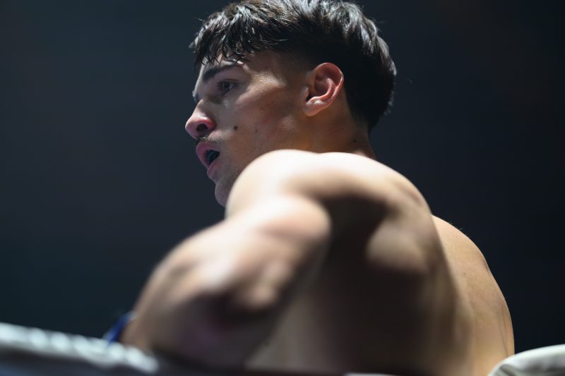 Boxers mid-fight in intense boxing match © Dirk Heurich dirksn.com