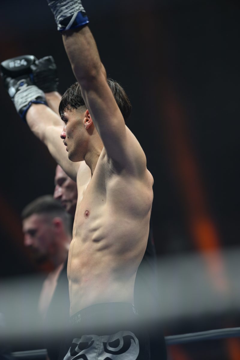 Boxers mid-fight in intense boxing match © Dirk Heurich dirksn.com