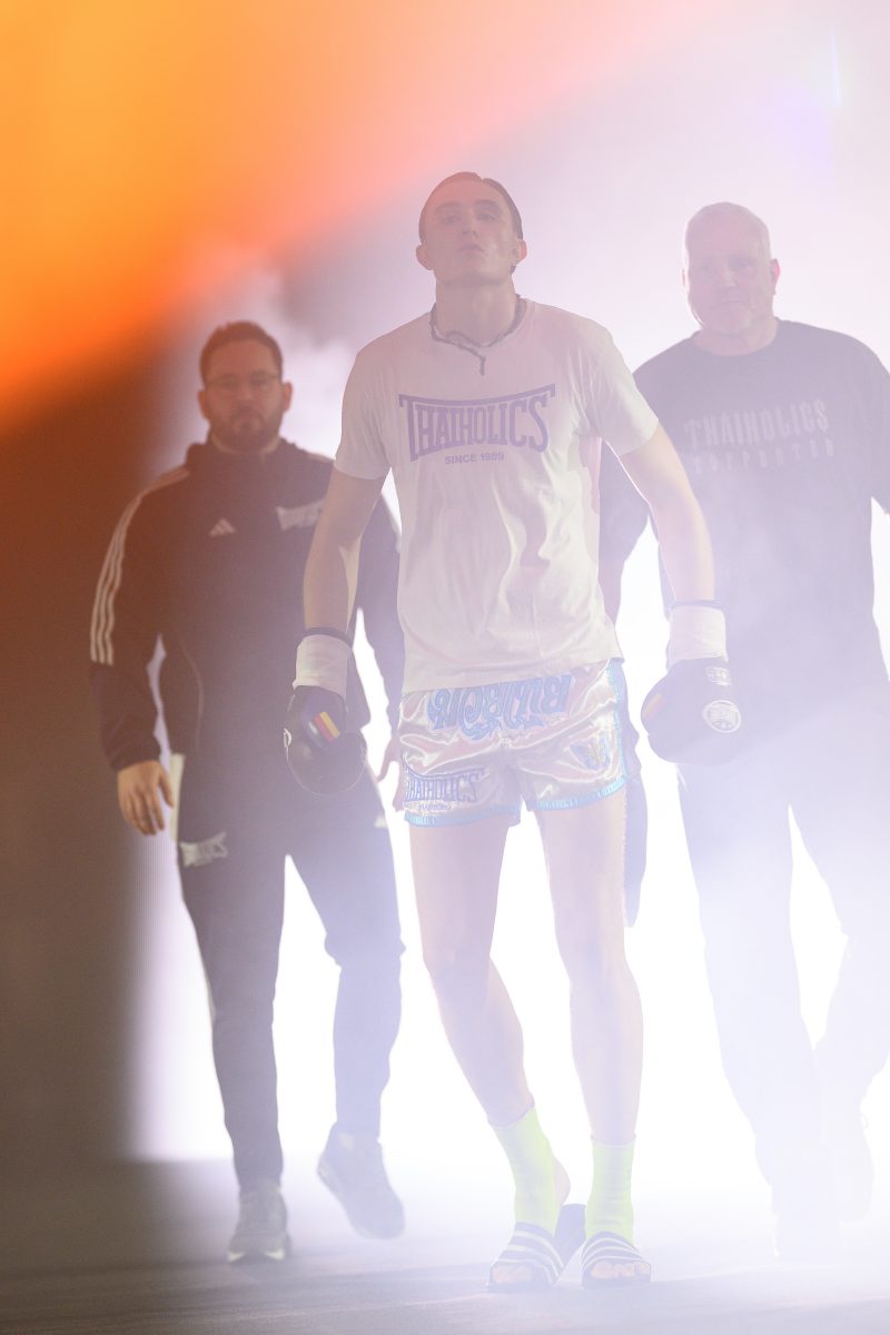Boxers mid-fight in intense boxing match © Dirk Heurich dirksn.com