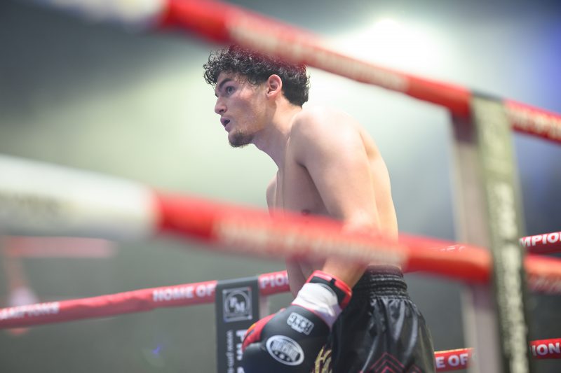Boxers mid-fight in intense boxing match © Dirk Heurich dirksn.com