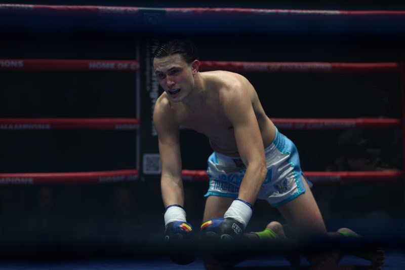 Boxers mid-fight in intense boxing match © Dirk Heurich dirksn.com