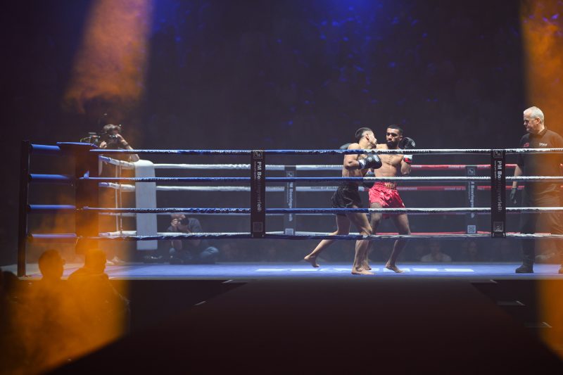 Boxers mid-fight in intense boxing match © Dirk Heurich dirksn.com