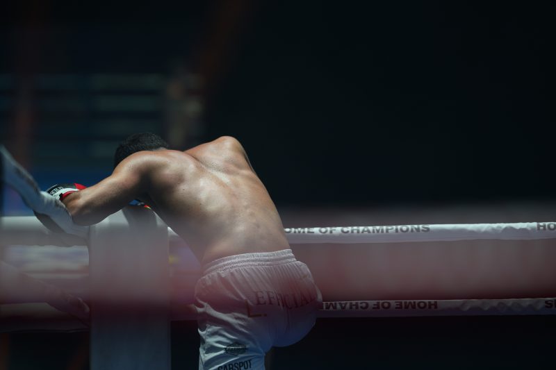 Boxers mid-fight in intense boxing match © Dirk Heurich dirksn.com