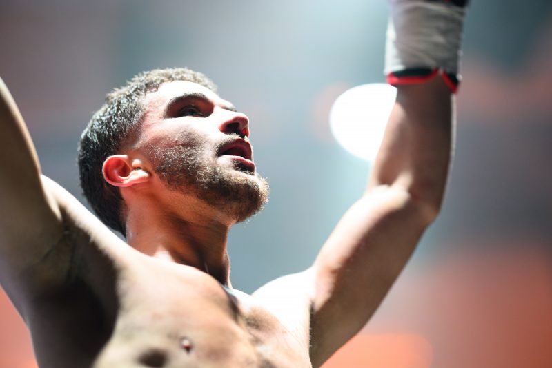 Boxers mid-fight in intense boxing match © Dirk Heurich dirksn.com