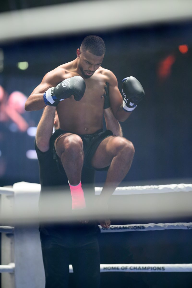 Boxers mid-fight in intense boxing match © Dirk Heurich dirksn.com