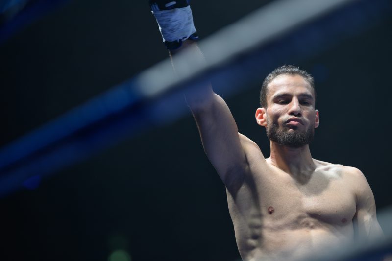 Boxers mid-fight in intense boxing match © Dirk Heurich dirksn.com