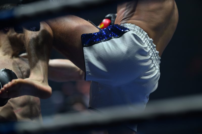 Boxers mid-fight in intense boxing match © Dirk Heurich dirksn.com