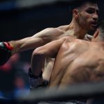 Boxers mid-fight in intense boxing match © Dirk Heurich dirksn.com