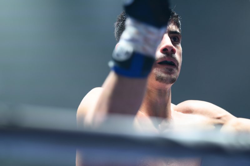 Boxers mid-fight in intense boxing match © Dirk Heurich dirksn.com