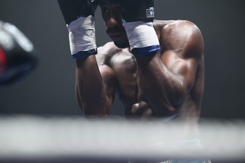 Boxers mid-fight in intense boxing match © Dirk Heurich dirksn.com