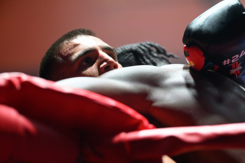 Boxers mid-fight in intense boxing match © Dirk Heurich dirksn.com