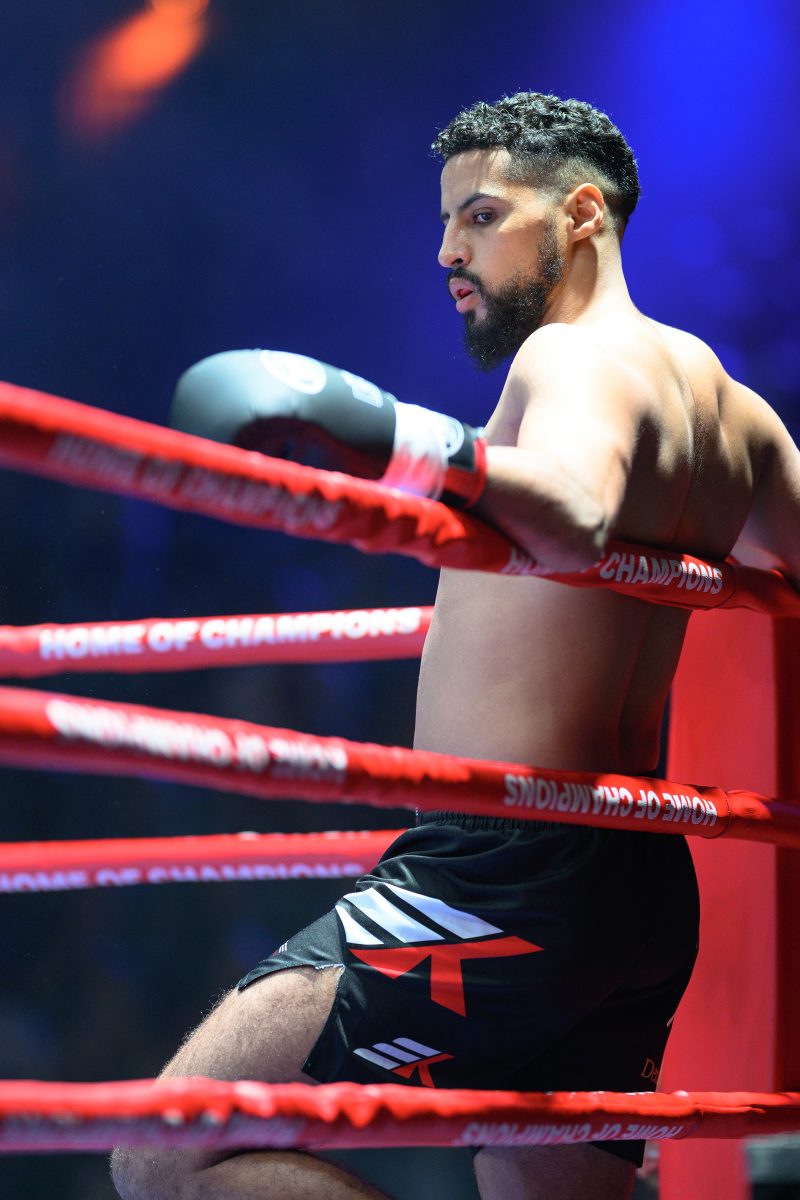 Boxers mid-fight in intense boxing match © Dirk Heurich dirksn.com