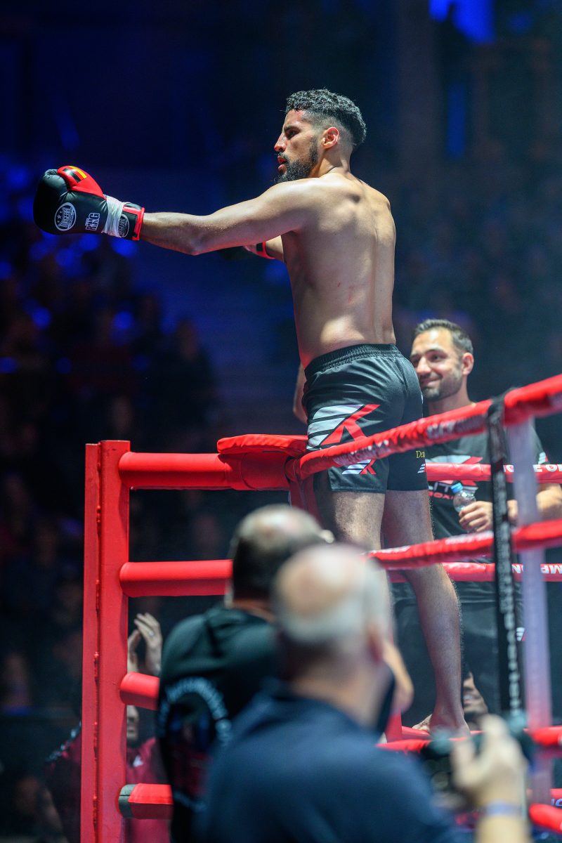 Boxers mid-fight in intense boxing match © Dirk Heurich dirksn.com