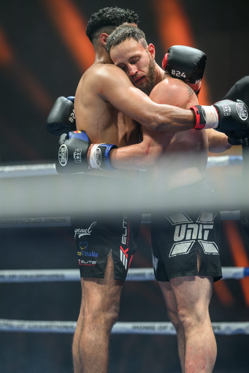 Boxers mid-fight in intense boxing match © Dirk Heurich dirksn.com
