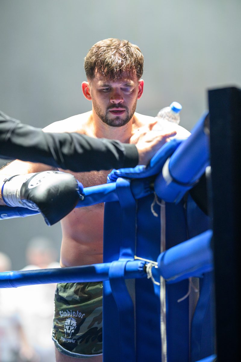Boxers mid-fight in intense boxing match © Dirk Heurich dirksn.com