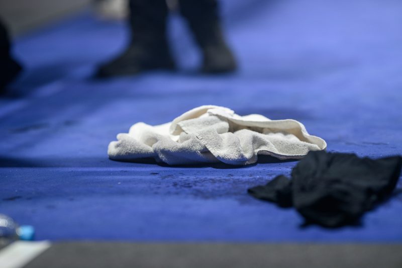 Boxers mid-fight in intense boxing match © Dirk Heurich dirksn.com